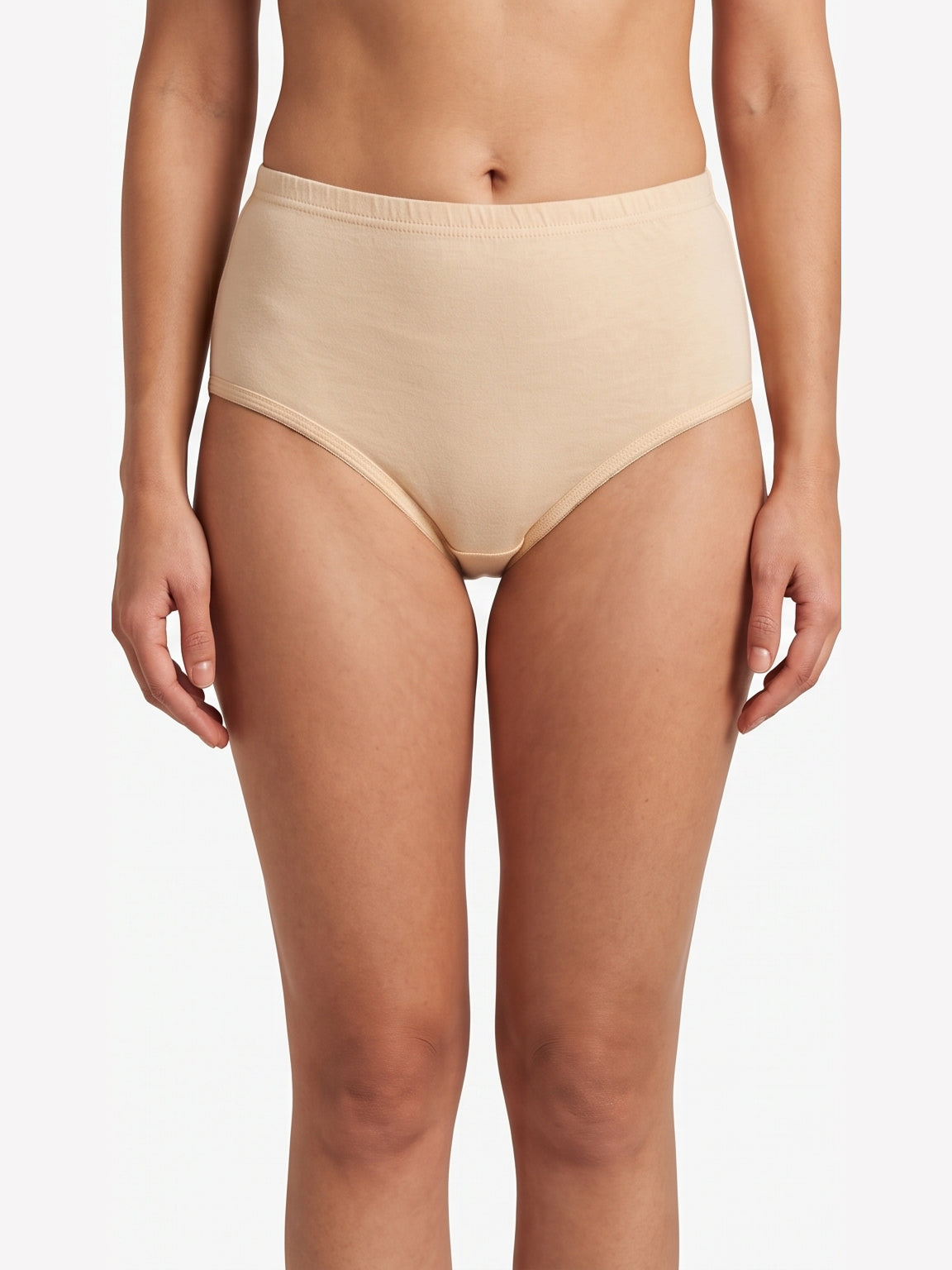 A model wearing high-waisted, seamless light beige briefs against a plain white background.