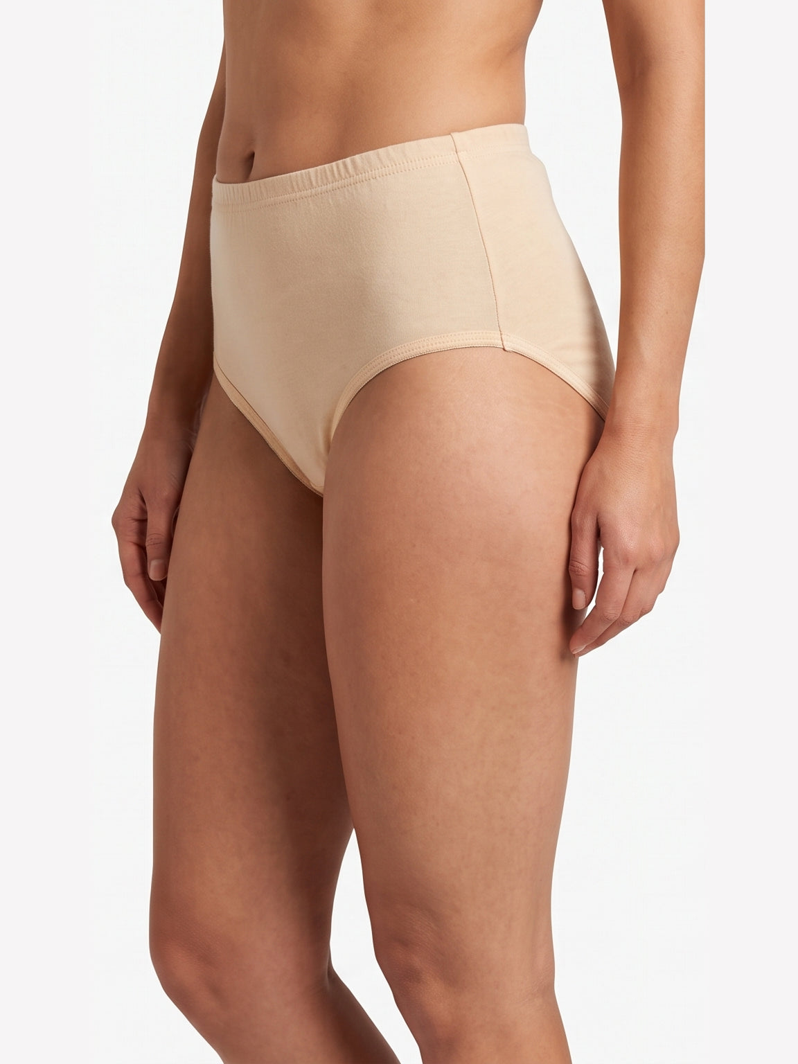 A model wearing high-waisted beige briefs against a clean white background.